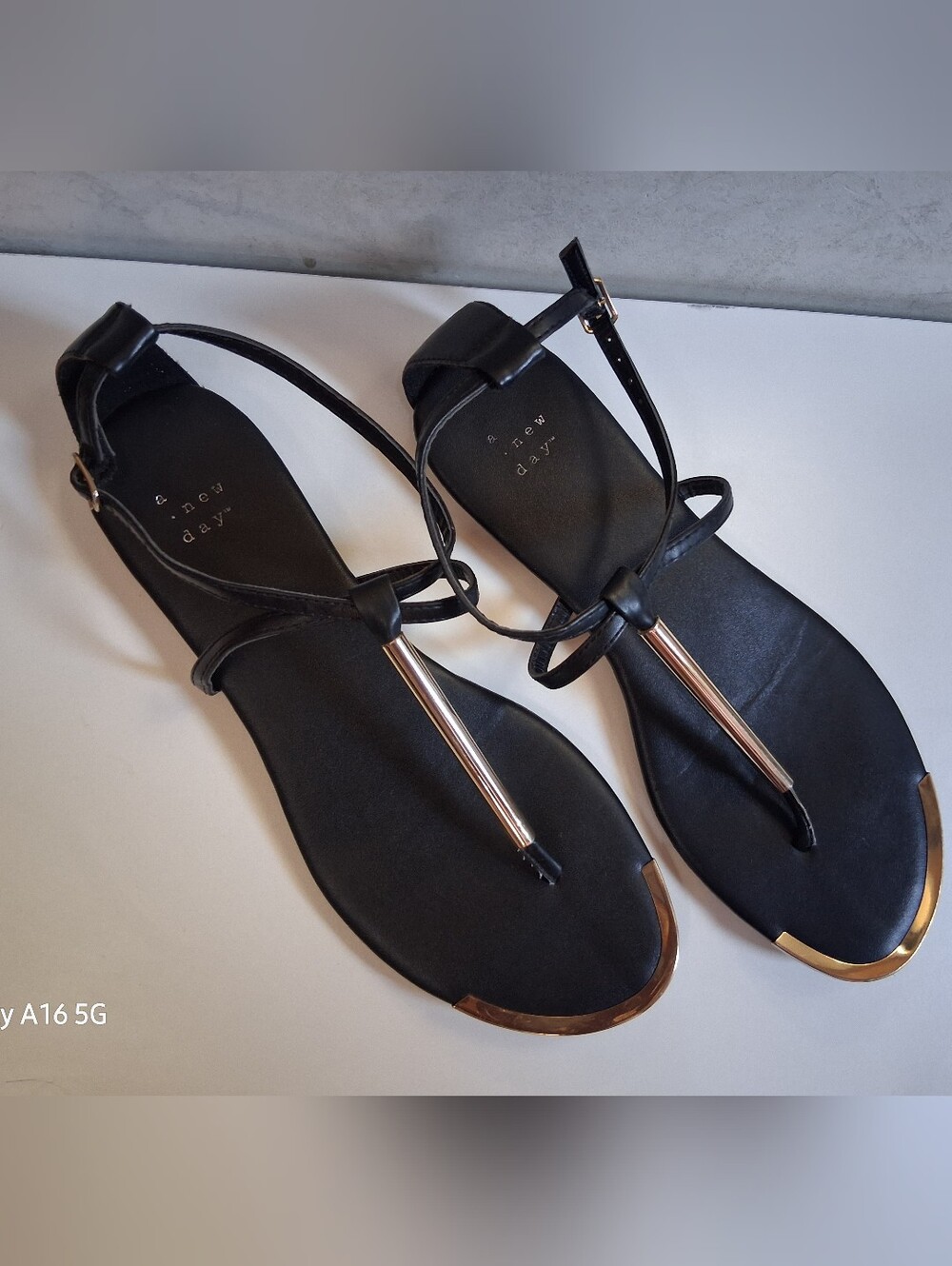 A New Day Black T-Strap Flat Sandals with Gold Accents Size 9